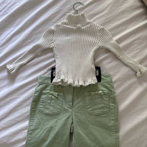 Turtle neck white shirt with ribbed green pants